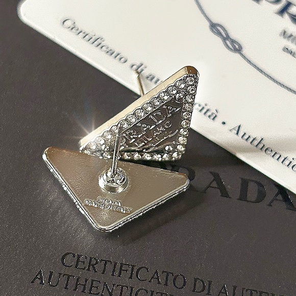 Mint Condition Prada silver triangle logo stud earrings. - Picture 1 of 12